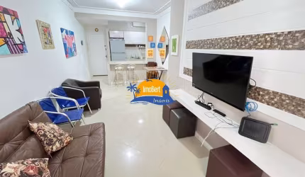 Apartamento à venda  na quadra da praia no Centro de Bertioga-SP: 2 quartos, 1 suíte, 2 salas, 2 banheiros e 70m² de área. Aproveite!