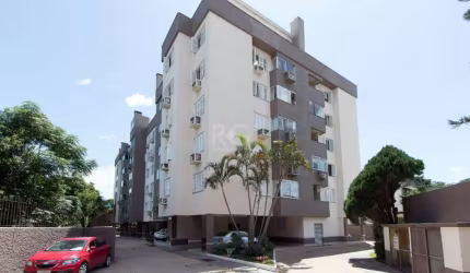 Ótima cobertura no bairro Nonoai, com aproximadamente 135m² de área privativa, 02 dormitórios com cama e armário, living com sofá e sacada fechada com vidros, cozinha americana com pia, armários, há d