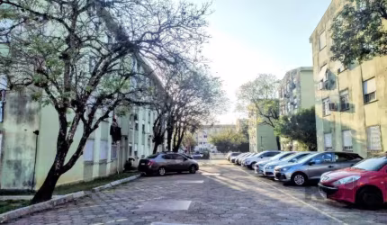 Apartamento 03 dormitórios, térreo, entrada e acesso totalmente planos, 60m² privativos - 01 vaga rotativa.    &lt;BR&gt; &lt;BR&gt;Apartamento térreo, 03 dormitórios, amplo living com sala em L, cozi
