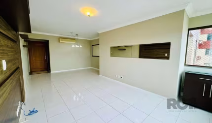 Apartamento com 95m² de  três dormitórios, uma suíte, living com dois ambientes,  churrasqueira, possibilidade de colocar lareira, cozinha, banheiro social, e um lavado, com duas vagas cobertas escrit