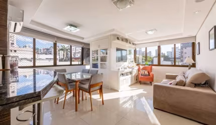 Apartamento semimobiliado com 80m² privativos e 2 vagas em rua nobre do Mont Serrat. Imóvel possui living amplo para 2 ambientes com churrasqueira, 2 dormitórios sendo 1 suíte, banho social, cozinha a