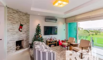 Casa à venda localizada na Rua do Pampa, no bairro Ecoville, em Porto Alegre. Este imóvel encanta com uma ampla sacada que integra a sala de estar, proporcionando uma vista encantadora e um ambiente e
