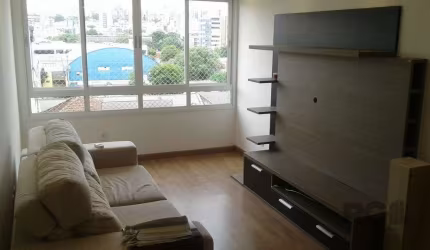 Apartamento mobiliado de 2 (dois) dormitórios, no bairro Rio Branco. Living para dois ambientes com sofá, painel e Split. Dormitórios mobiliados. Banheiro com box. Cozinha mobiliada com churrasqueira.