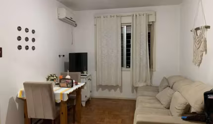 Apartamento de 2 dormitórios, living, cozinha, área de serviço e banheiro social.