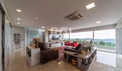 asa com vista deslumbrante do Guaíba. &lt;BR&gt;Casa com 3 dormitórios sendo 1 suíte com sacada, living amplo com sacadão, lareira, cozinha americana, lavanderia, gabinete/quarto de hóspedes, estúdio,