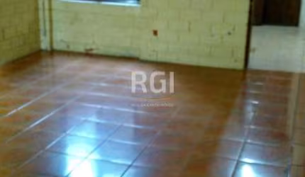 Casa de 3 dormitórios no bairro Santana, living para 2 ambientes, cozinha, área de serviço, banheiro, banheiro auxiliar e quintal. Possui uma vaga de garagem.  Excelente localização!