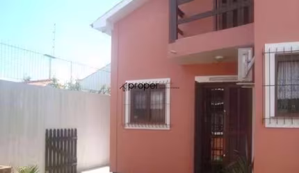 Sobrado com 4 dormitórios à venda, 328 m² por R$ 850.000,00 - Laranjal - Pelotas