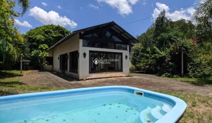 Casa em condomínio fechado com 5 quartos à venda na PITANGUEIRA, 206, São Lucas, Viamão, 249 m2 por R$ 700.000