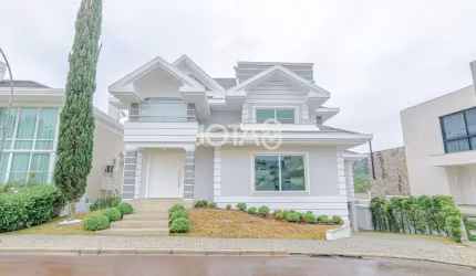 Casa com 4 suítes em condomínio - J8