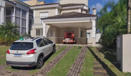 Casa com 3 dormitórios, 220 m² - venda por R$ 2.200.000,00 ou aluguel por R$ 10.178,52 - Alphaville - Gravataí/RS