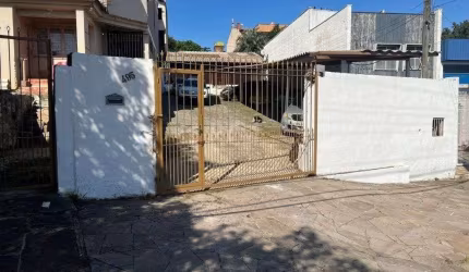 Terreno de 392m² com casa mista de 82m²