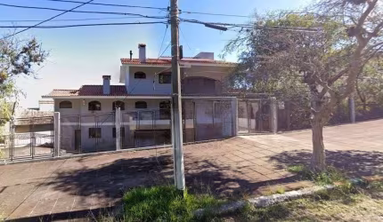 Casa de Alto Padrão para Alugar — 650 m², 5 Suítes, Salão de Festas e Sustentável — Pedra Redonda, Porto Alegre