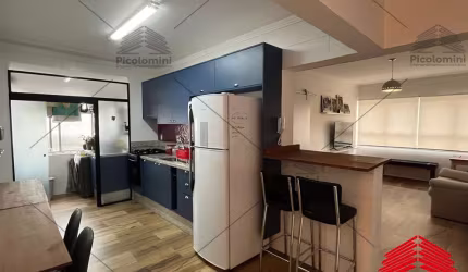 Apartamento mobiliado para locação na Mooca de 51m² com cozinha planejada, sala 2 ambientes, dormitório, banheiro social e área de serviço.