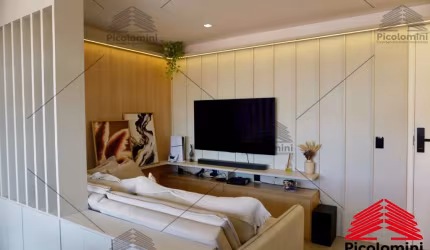 Apartamento à venda no Jardim Vila Galvão, 47m² com 2 quartos, cozinha americana, sala 2 ambientes com varanda integrada, banheiro social e 1 vaga.