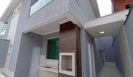 Sobrado com 3 dormitórios à venda, 135 m² por R$ 990.000,00 - Tupi - Praia Grande/SP