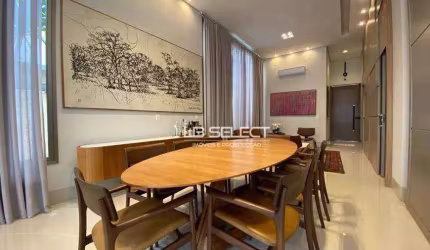 Casa térrea com três suítes, escritório com lavabo e área gourmet completa.
