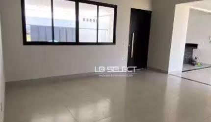 Casa no bairro Vida Nova com três quartos, suíte e varanda gourmet com churrasqueira.