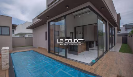 Casa no Condomínio Alphaville II com três suítes, escritório com lavabo e varanda gourmet completa.
