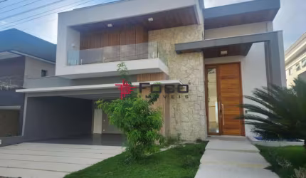 Casa com 4 suítes, 450m² por R$ 3.150.000,00 - Condomínio Residencial Jaguary
