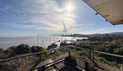 Casa com 5 quartos à venda na Rua Bororó, 699, Vila Assunção, Porto Alegre por R$ 1.910.000