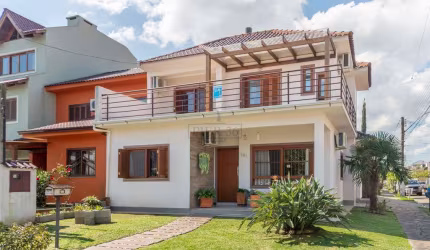 Casa em condomínio fechado com 3 quartos à venda na Rua Manacá, 101, Hípica, Porto Alegre por R$ 890.000