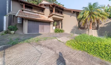 Casa com 3 quartos à venda na Rua Edgar Luiz Schneider, 510, Jardim Isabel, Porto Alegre por R$ 1.450.000
