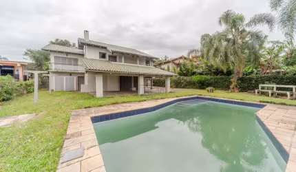 Casa em condomínio fechado com 3 quartos à venda na Avenida Firmino Octávio Bimbi, 255, Cavalhada, Porto Alegre por R$ 2.000.000