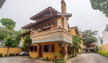 Casa em condomínio fechado com 3 quartos à venda na Avenida Coronel Marcos, 2171, Pedra Redonda, Porto Alegre por R$ 890.000