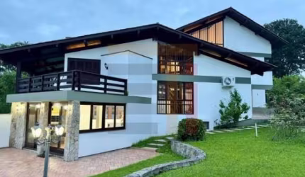 Casa em condomínio fechado com 4 quartos à venda na Rodovia Haroldo Soares Glavan, 1900, Cacupé, Florianópolis por R$ 2.900.000