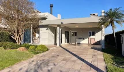 Casa em condomínio fechado com 3 quartos à venda na Da Lagoa, 1111, Farroupilha, Osório, 180 m2 por R$ 1.590.000
