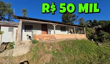 [840] CASA EM TAQUARA COM 3 DORMITÓRIOS, 2 BANHEIROS, POÇO ARTESIANO, AO LADO DA RS 020