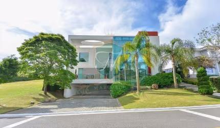 casa de 615 m²  a venda no alphavile graciosa, com 5 suites, 7 bh, 3 salas, 4 gar.,cozinha americana completa,  piscina aquecida, edicula, escritorio