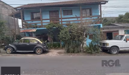 Casa com 3 quartos, vaga de garagem, churrasqueira, no bairro Partenon, Porto Alegre/RS