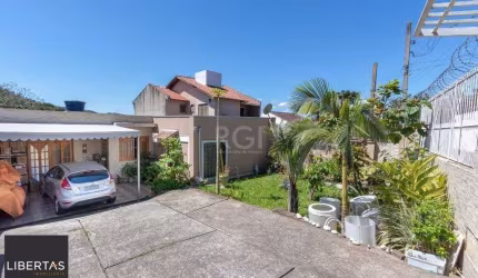 Casa para Venda - 370m², 4 dormitórios, sendo 1 suites, 6 vagas - Lomba do Pinheiro