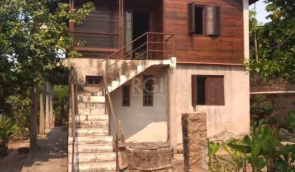 Casa 4 dormitórios à venda Vila Nova Porto Alegre/RS
