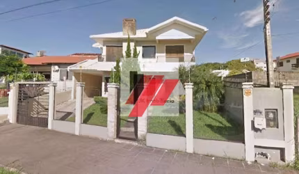 Casa com 4 dormitórios à venda, 309 m² por R$ 1.800.000,00 - Centro - Torres/RS