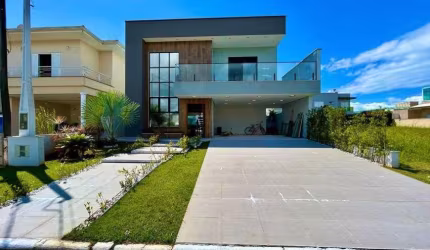 Casa em condomínio com piscina, 4 quartos e área gourmet em Peruíbe.