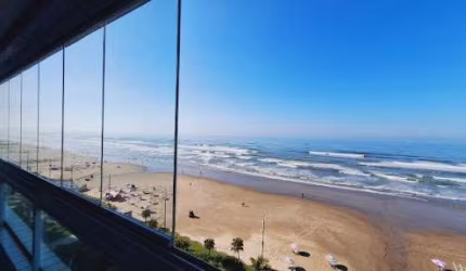 Apartamento com 2 dormitórios 1 suíte terraço gourmet envidraçada frente mar  à venda, 72 m² por R$ 570.000 - Caiçara - Praia Grande/SP