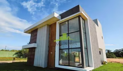 Casa à venda em Guarajuba: 4 suítes, piscina com hidromassagem, área gourmet, nascente total, 192m² de área construída. Condomínio Canto de Guarajuba.