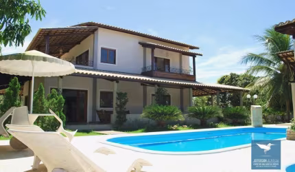 Alugo Casa Duplex em Condomínio Chácaras a 5 Minutos do Centro do Eusébio, 05 Suítes, Lote 3.850m2, Amplo Deck com Piscina e Salão de Jogos, 800m2 de Construção.