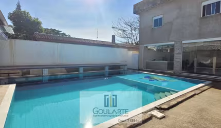 Casa alto padrão com 7 dormitórios sendo 6 suítes, lazer no quintal - PERNAMBUCO - Guarujá/SP