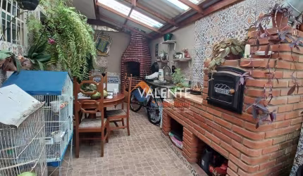 Casa com 3 dormitórios à venda, 135 m² por R$ 600.000,00 - Maracanã - Praia Grande/SP