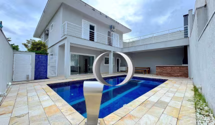 Casa em condomínio com piscina, espaço gourmet, 4 suítes à venda, 300 m² por R$ 1.600.000 - Jardim Albamar - Guarujá/SP