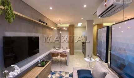 Apartamento 44M², dois dormitórios, um banheiro, sala de estar, varanda com lavanderia e uma vaga.
