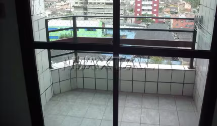 Apartamento à venda em Santos, com 2 dormitórios, cozinha planejada e ar condicionado, e 1 vaga.
