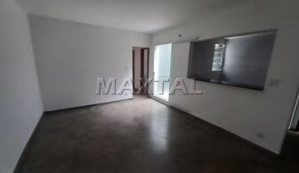 Apartamento em Santana com 56m², 2 dormitórios, sala ampla, cozinha, banheiro e área de serviço.