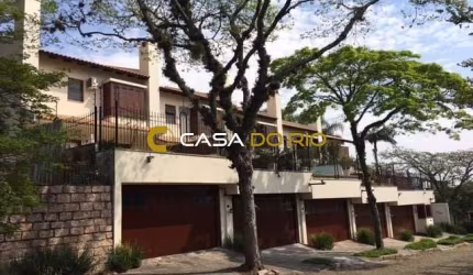 Casa em condomínio fechado com 3 quartos à venda na Rua Bororó, 708, Vila Assunção, Porto Alegre por R$ 1.290.000