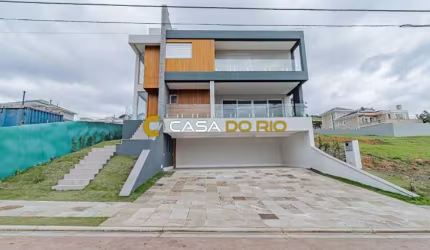 Casa em condomínio fechado com 4 quartos à venda na Estrada das Três Meninas, 2001, Vila Nova, Porto Alegre por R$ 2.300.000