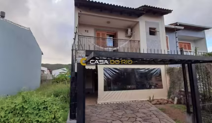 Casa com 3 quartos à venda na Rua Attilio Bettio, 92, Aberta dos Morros, Porto Alegre por R$ 580.000
