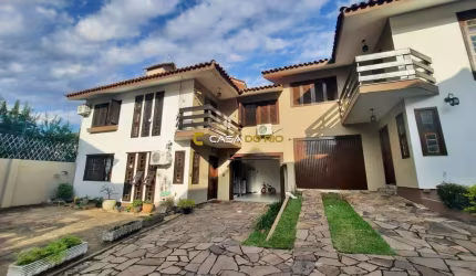 Casa em condomínio fechado com 3 quartos à venda na Rua Doutor Mário Totta, 1925, Camaquã, Porto Alegre por R$ 570.000